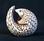 Pangolin palm charm